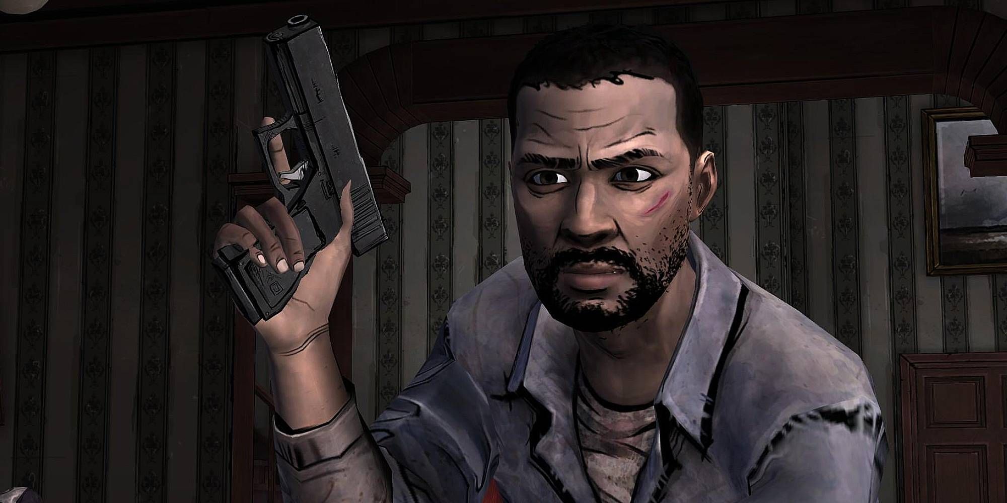 Lee Everett from The Walking Dead crouches while holding a gun 