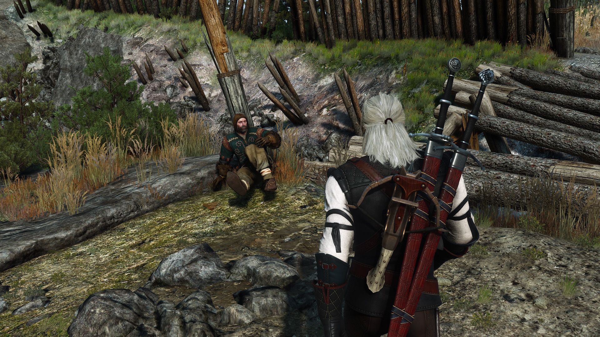 Geralt walks toward an ostensibly hurt man leaning against a shattered post in Skellige.