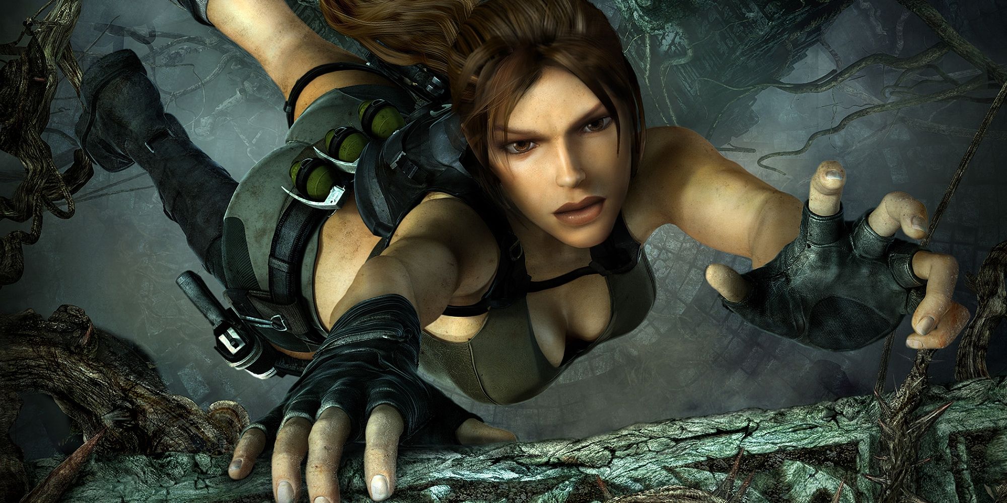 Lara Croft scrapes at the edge of a cliff in Tomb Raider Underworld