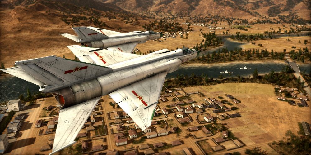 a pair of mig fighter jets over a settled area in wargame: red dragon