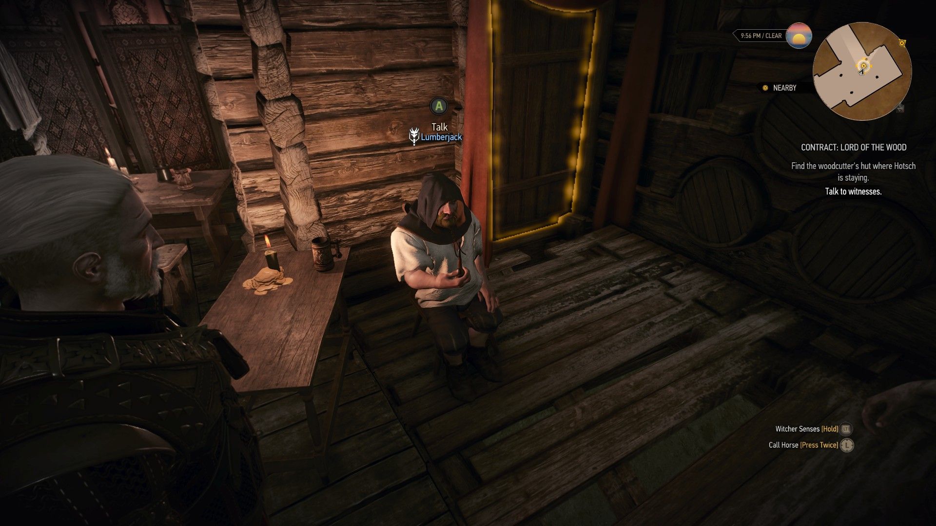 A screenshot of Geralt looking at a dwarf.