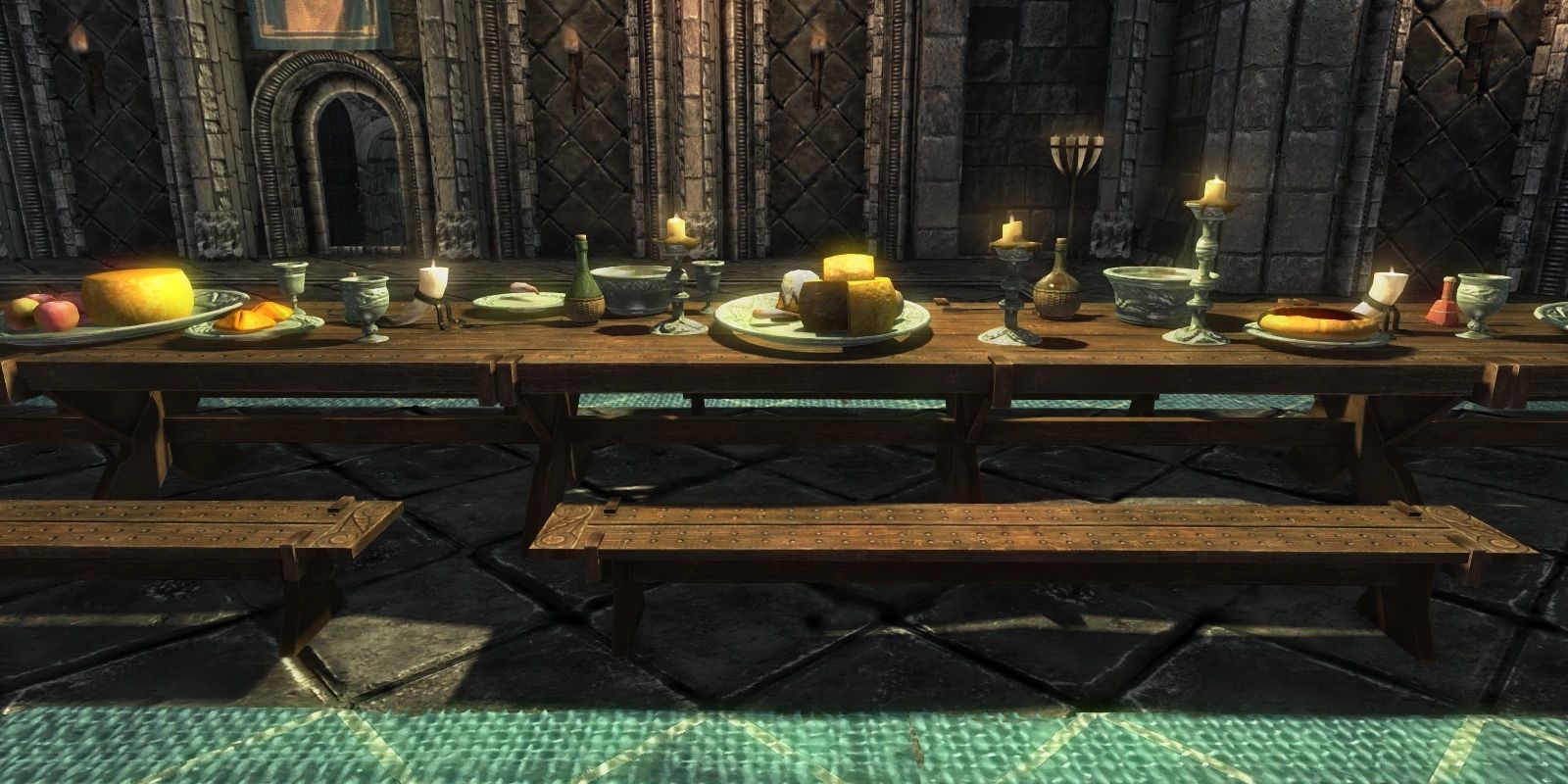 A dining table with plates of food and goblets on it