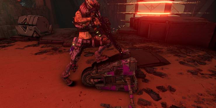 Claptrap is pinned and threatened by a character with a long gun.