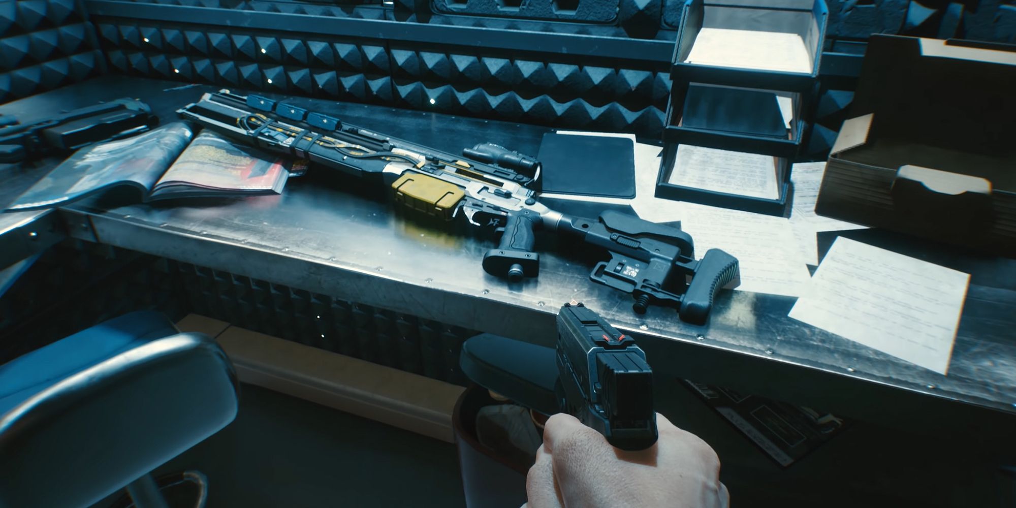 An image from Cyberpunk 2077 of V wielding a pisto and looking at a sniper inside of the apartment stash.