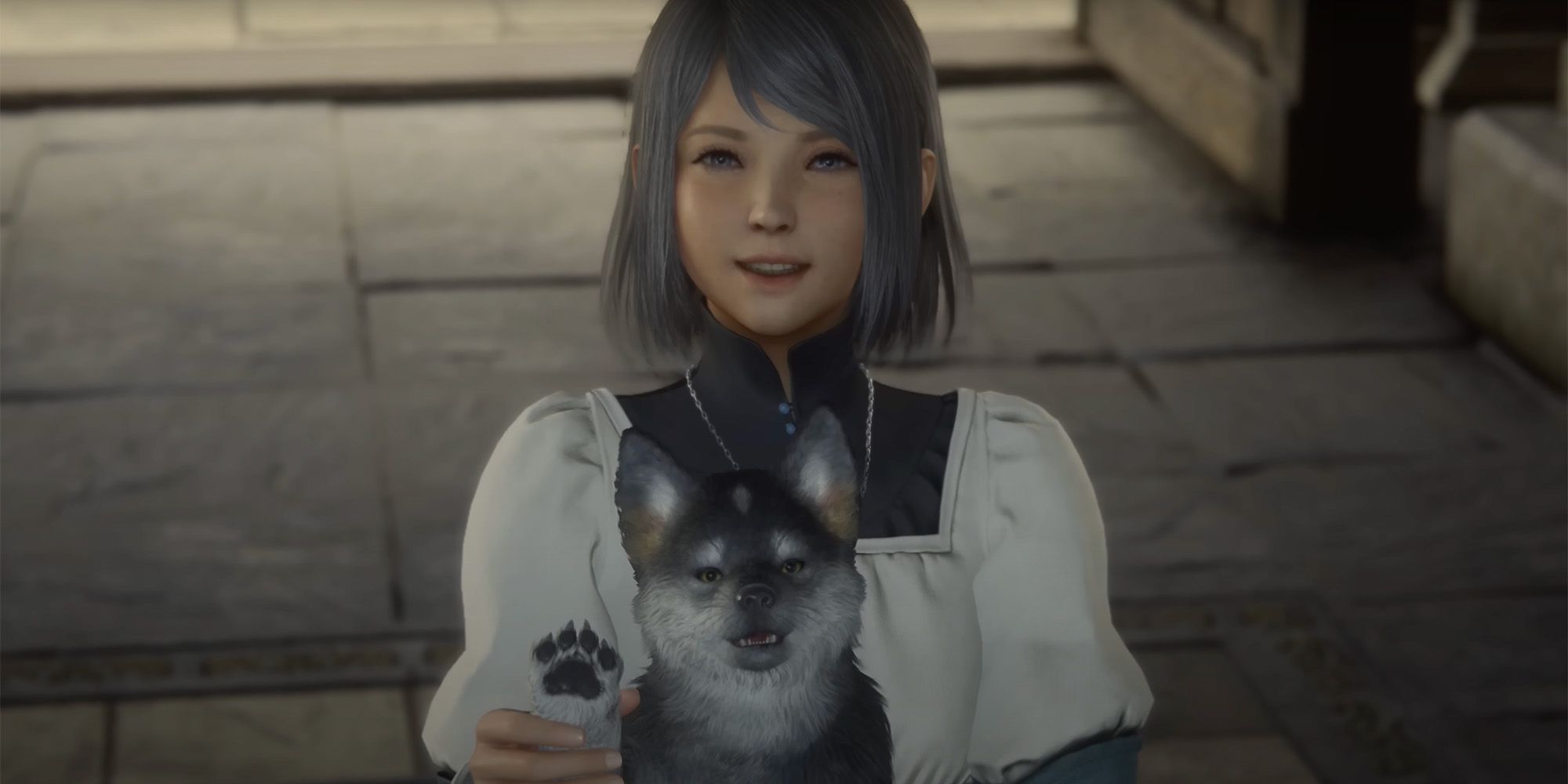 Final Fantasy 16 – Jill lächelt, während sie Torgal hält