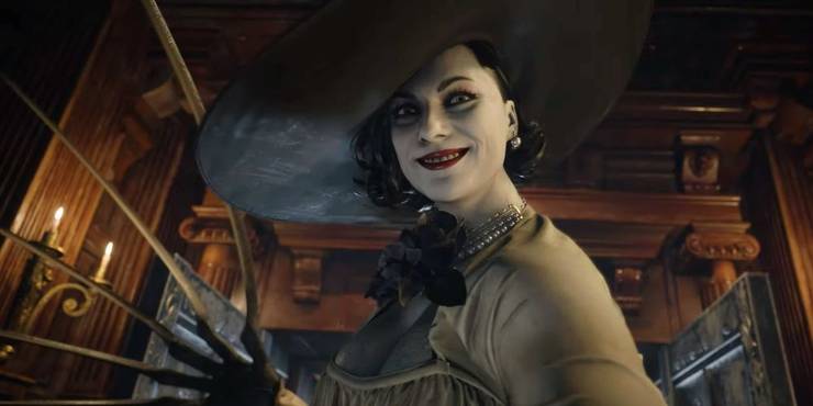 Lady Dimitrescu smiling at the viewer with claws ready to strike