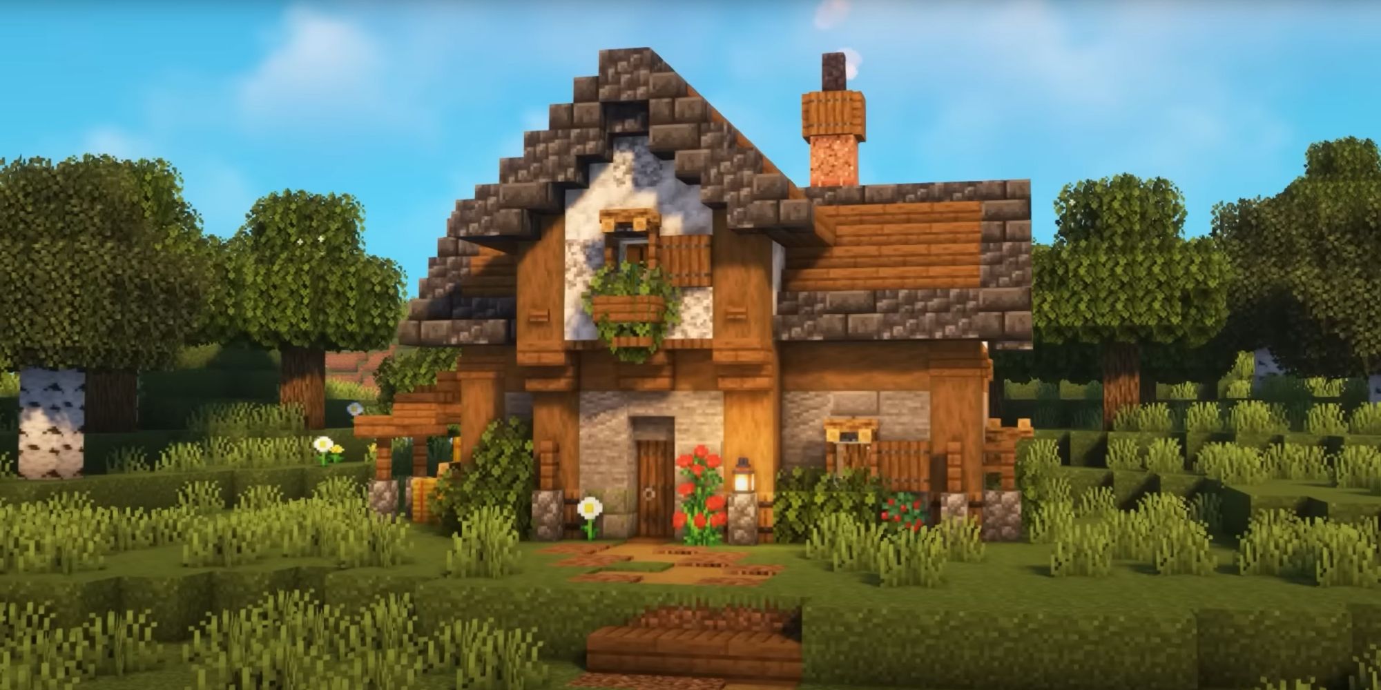 An image from Minecraft of a starter house constructed with spruce wood and deepslate cobblestone. This house is in a traditional style with two floors.