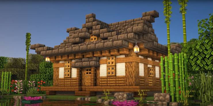 An image from Minecraft of a Japanese Survival House, which uses deep slate to make a peaked roof.