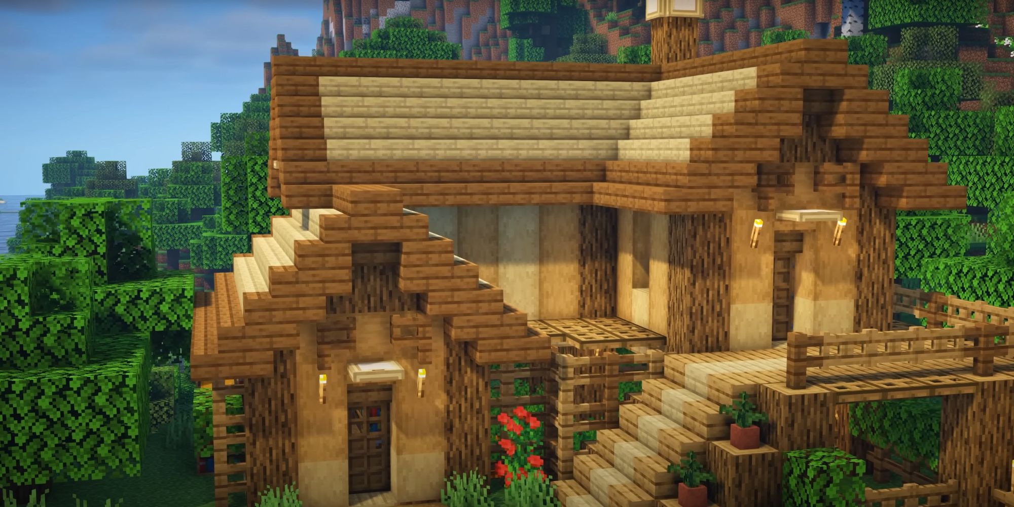 An image from Minecraft of Starter Oak House. This house is modeled after a villager house, and is made up of oak and birch wood, with a lower level for farming and enchanting.