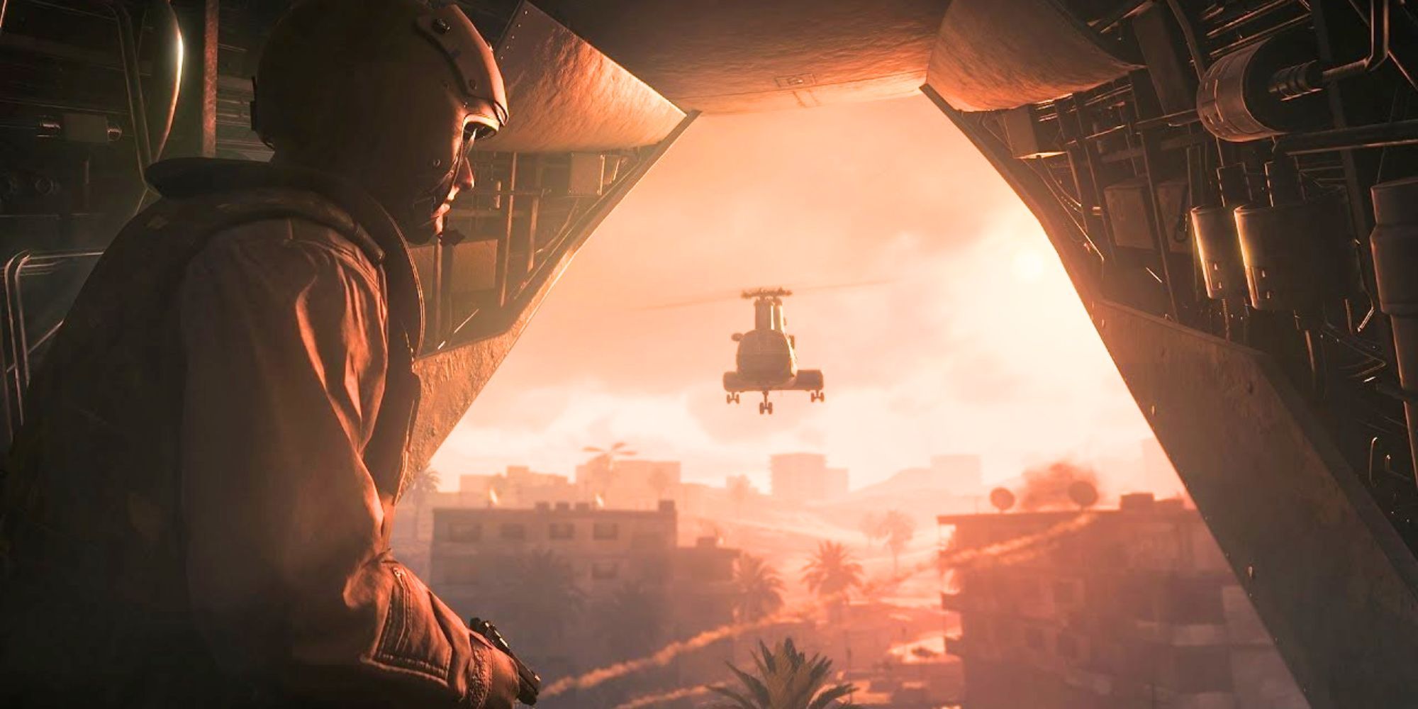 Ein Soldat blickt von der Hintertür eines Flugzeugs nach draußen.  Ein weiterer Hubschrauber fliegt vor dem Hintergrund eines roten Himmels