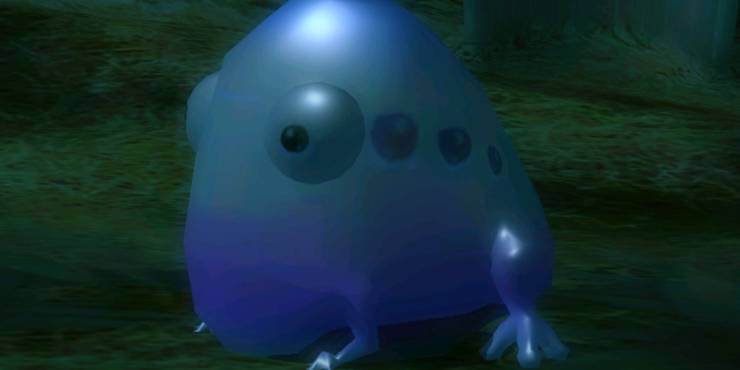 A pink variant of the Wollywog standing in the dark night