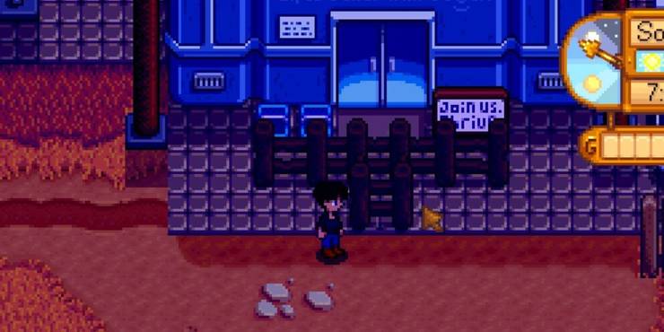 The entrance of a Joja Corp store is blocked by wooden fencing.