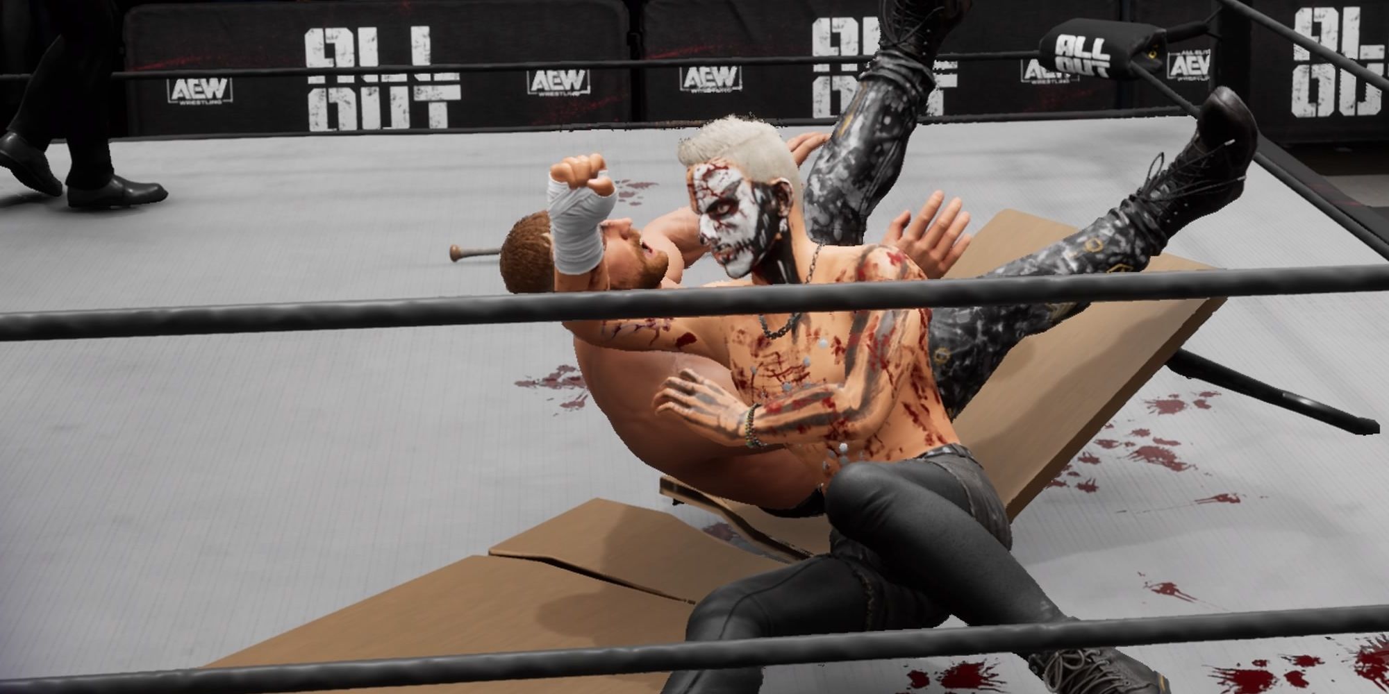 Darby Allin breaks a table after he elbow drops Jon Moxley through it in AEW Fight Forever.