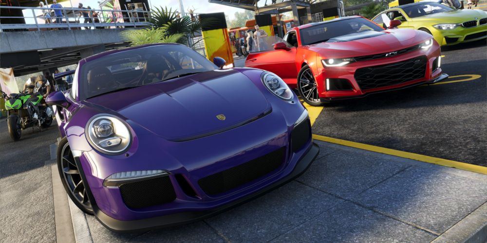 The Crew 2 Blue, Red, and Lime cars next to each other