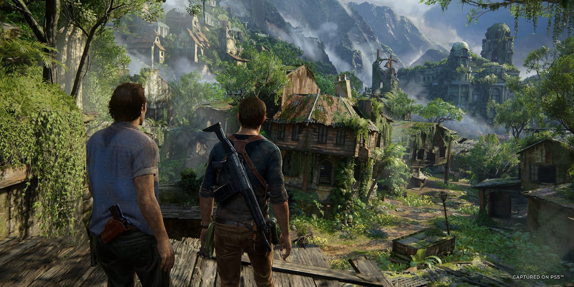 Nathan and Sam stand at the entrance of ruins