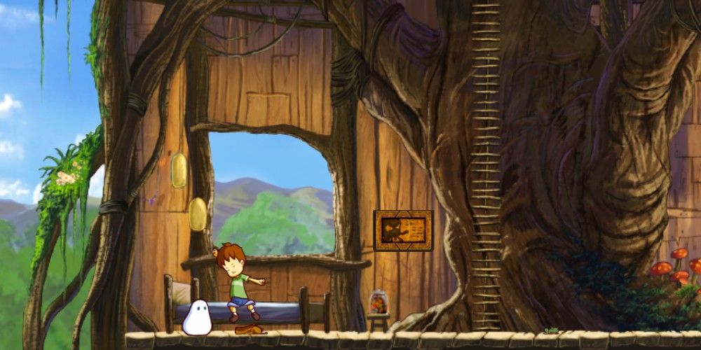 A cozy-looking wooden interior room with a boy and his blob in the middle of the screen