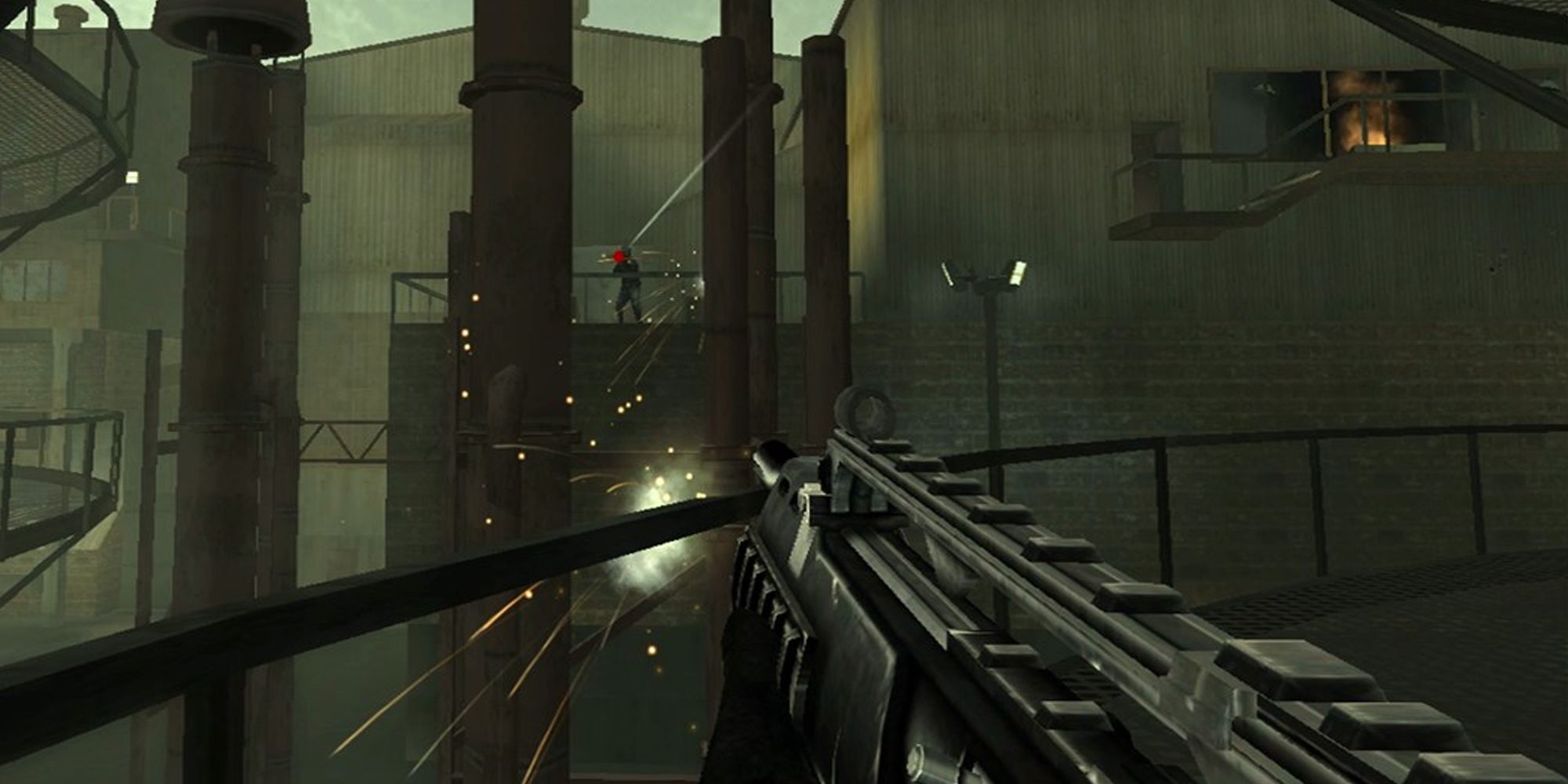 Black EA screenshot showing player pointing a gun at an enemy on a distant ledge in a factory 