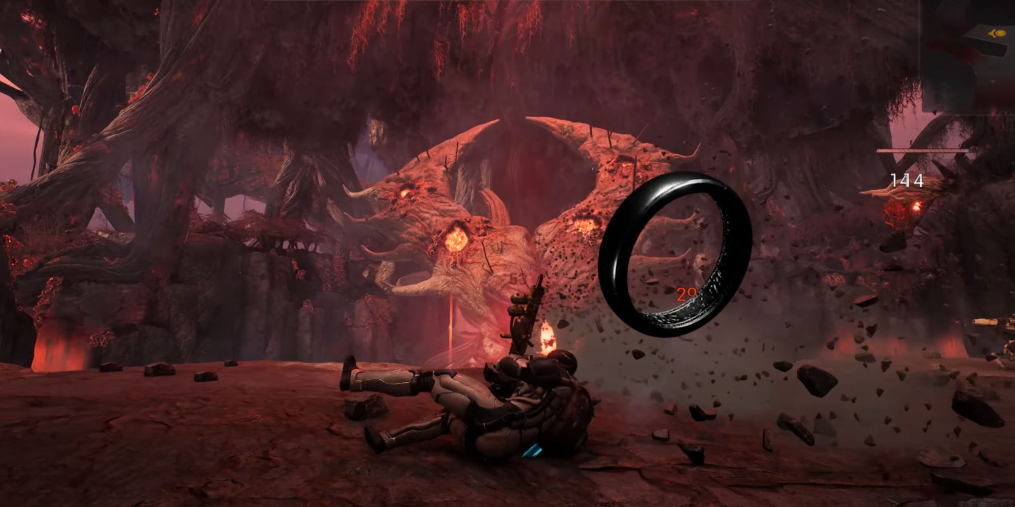 A player rolls to avoid an attack that flung stones into the air from the impact in Remnant 2.