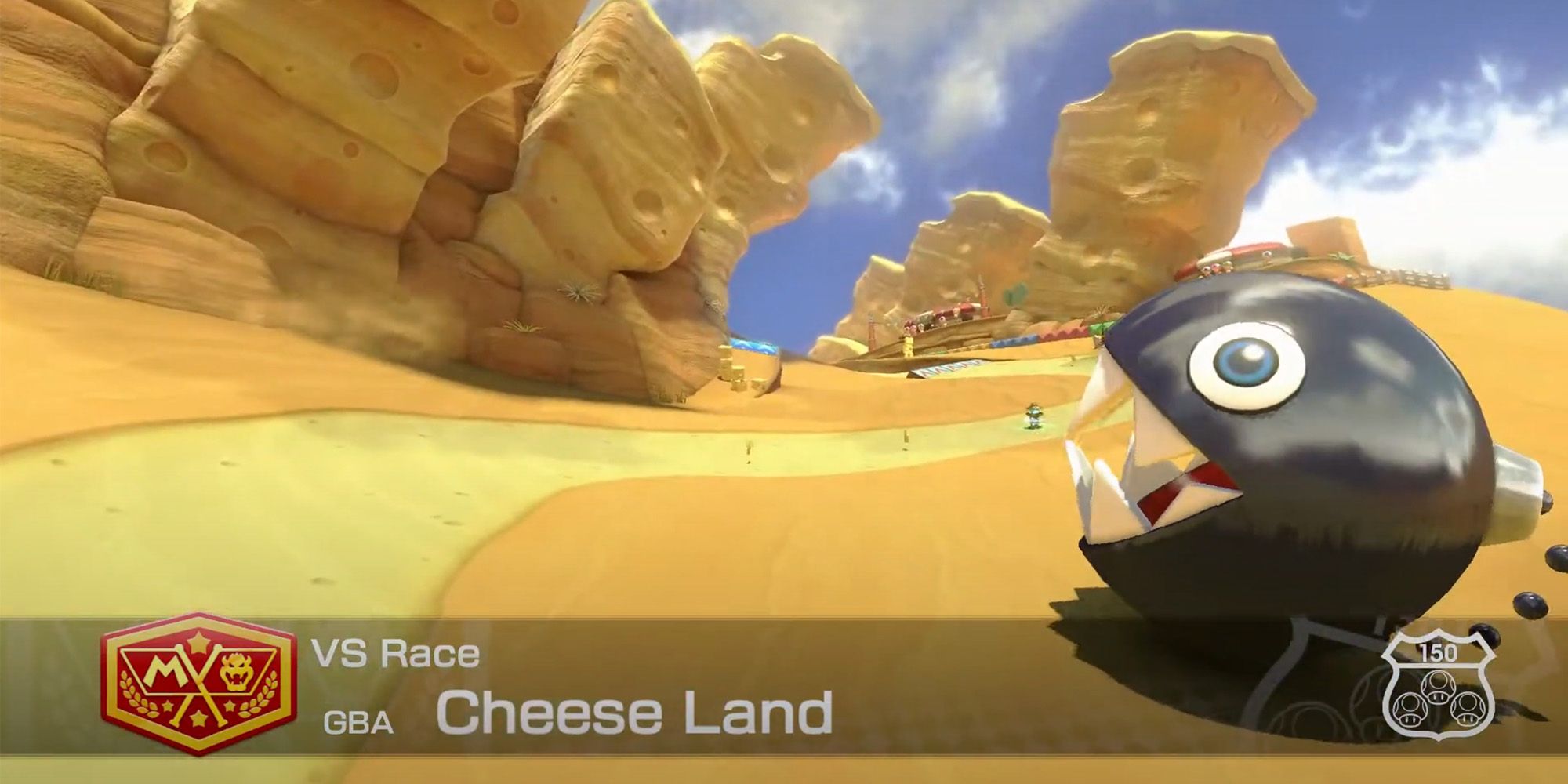 Mario Kart 8 - Cheese Land - A Chain Chomp Hopping Around A Desert Filled With Giant Blocks Of Cheese