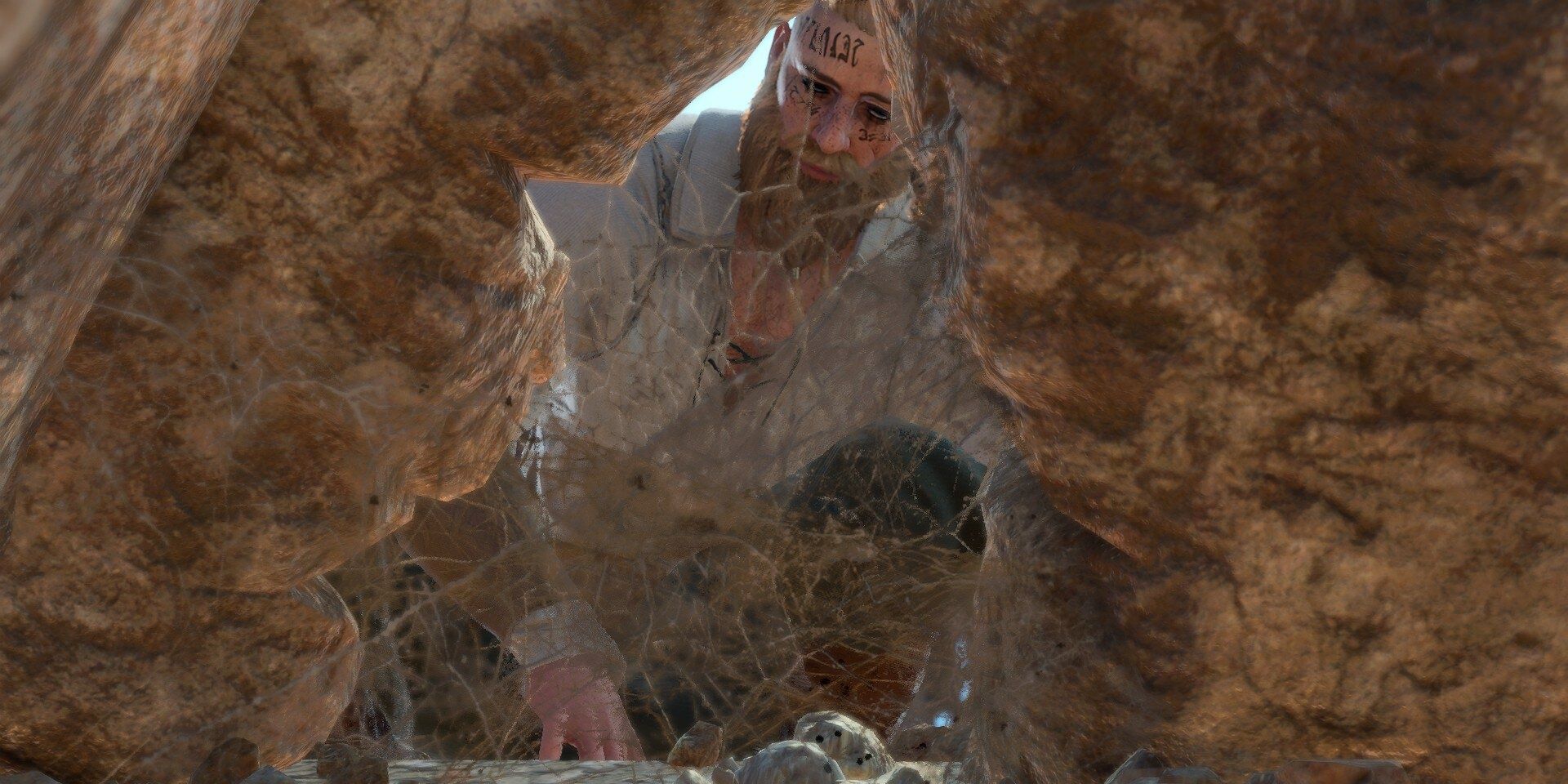 Tav looking into a web-filled crevice in baldur&rsquo;s gate 3