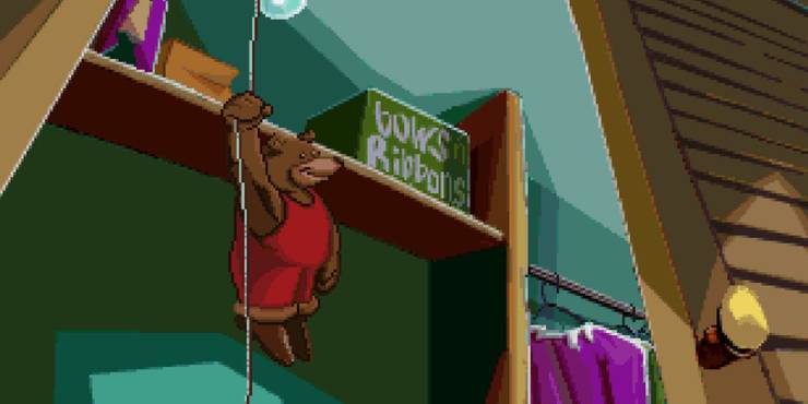 Fatty Bear hanging off a shelf inside a closet. 