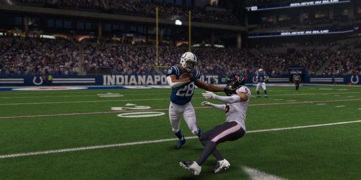 Jonathan Taylor stiff arm defender