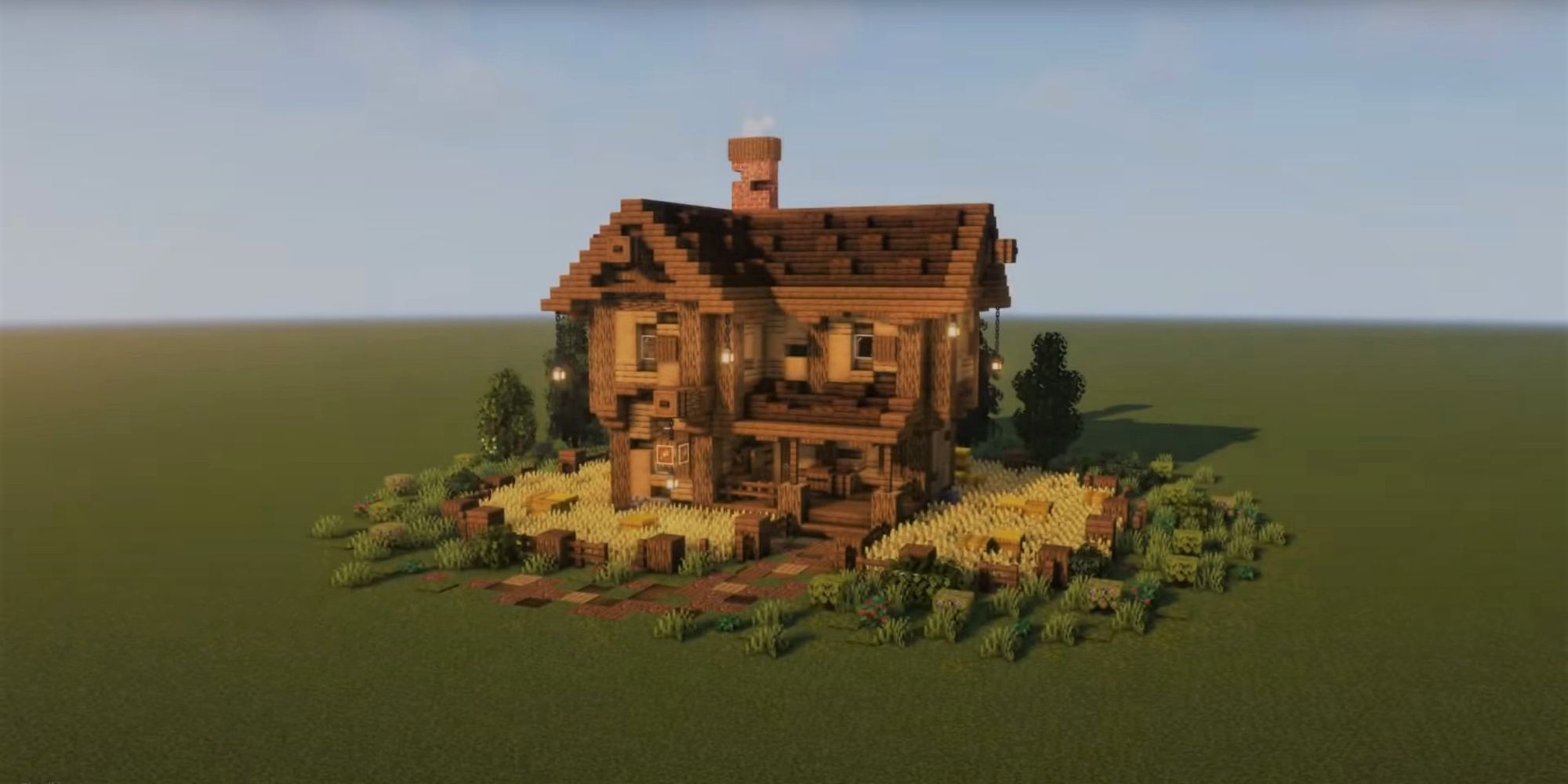 An image from Minecraft of an upgraded Villager Farmhouse. This two story house is made out of wood and features multiple wheat fields around the home.