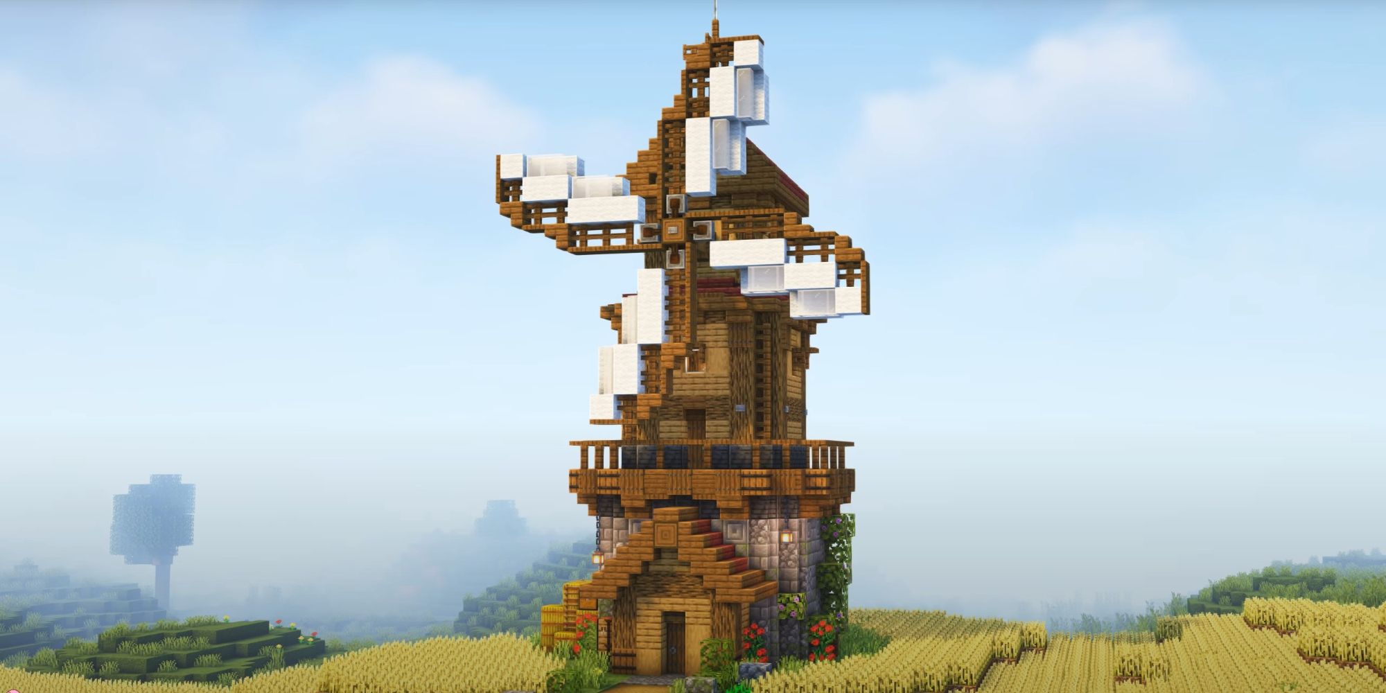 An image from Minecraft of a large windmill. This can be added onto largescale farms to create a nice visual upgrade to your build