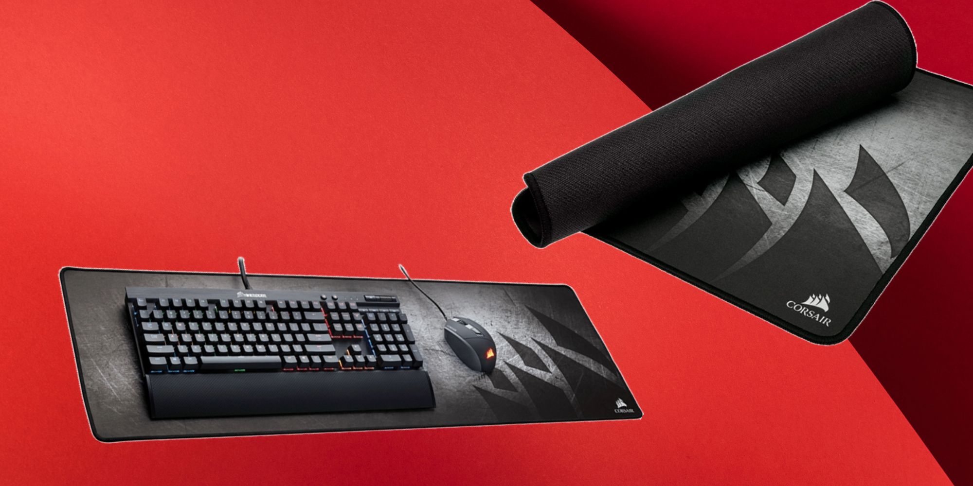 A grey and black cloth mouse pad with the Corsair logo in the corner, striking against a red background.