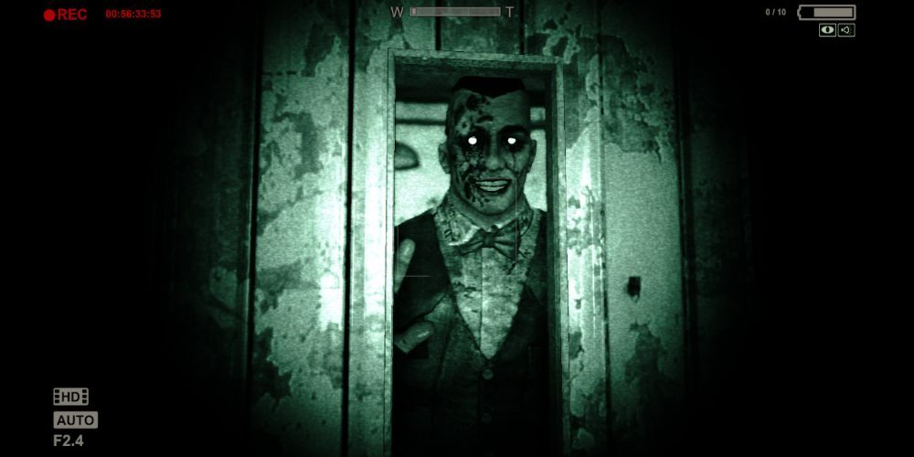 Outlast nightvision shot of asylum patient smiling