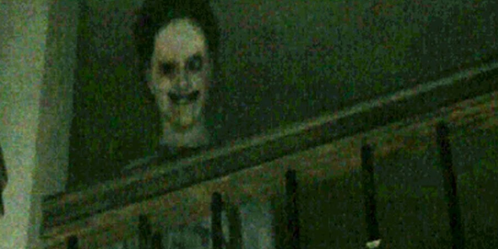 PT Demo Kojima screenshot of a creepy masked figure looking down from a bannister