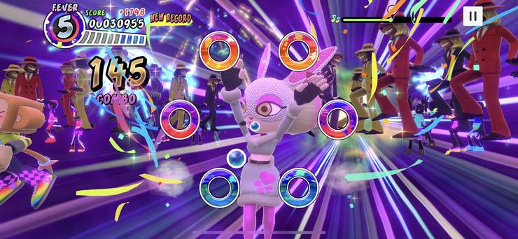 Rabinna dances against a bevy of canine backup dancers during a performance in Samba de Amigo: Party-To-Go.
