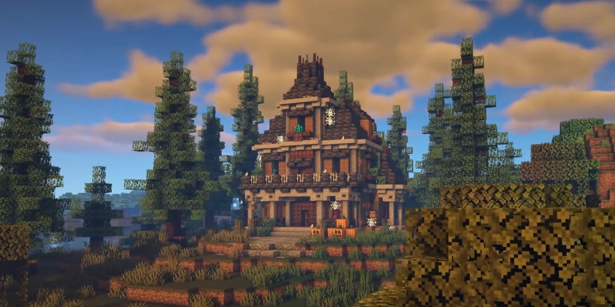 An image from Minecraft of a small haunted house resting on a hill