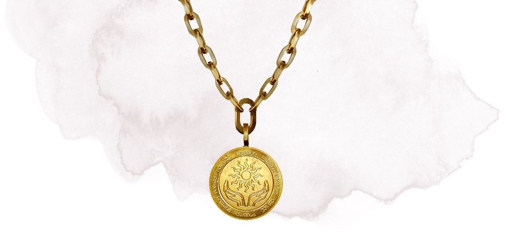 Amulet of Health From Dungeons & Dragons, A Gold Amulet Engraved With Cupped Hands Holding The Sun