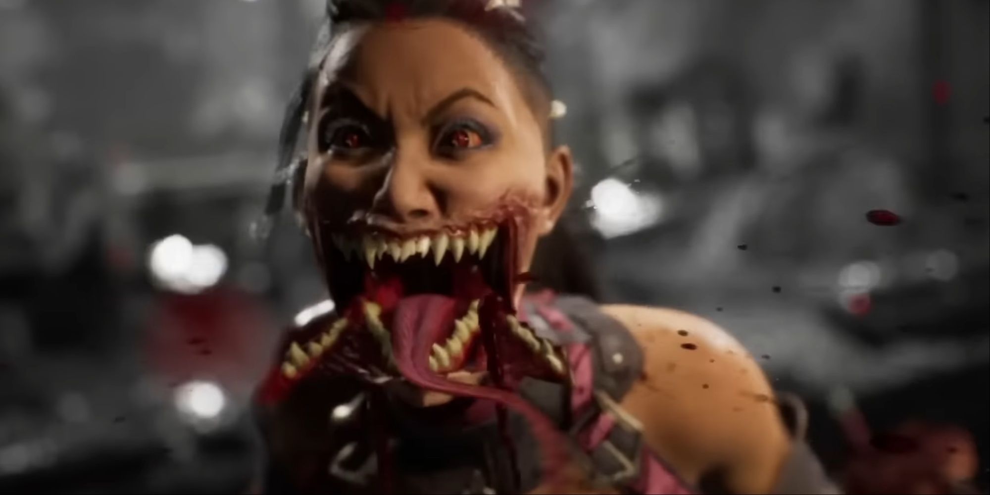 A close-up of Mileena's face with her mouth wide open and blood hitting the camera after her fatality.