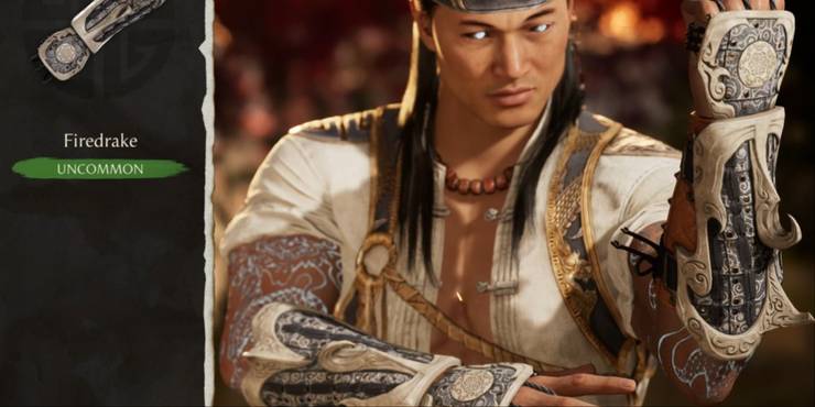 Liu Kang's character wearing the detailed ivory Firedrake gear in the selection menu in MK1.