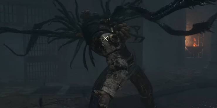 A giant doll with a Plaga-tentacled head about to take a swing at the player.