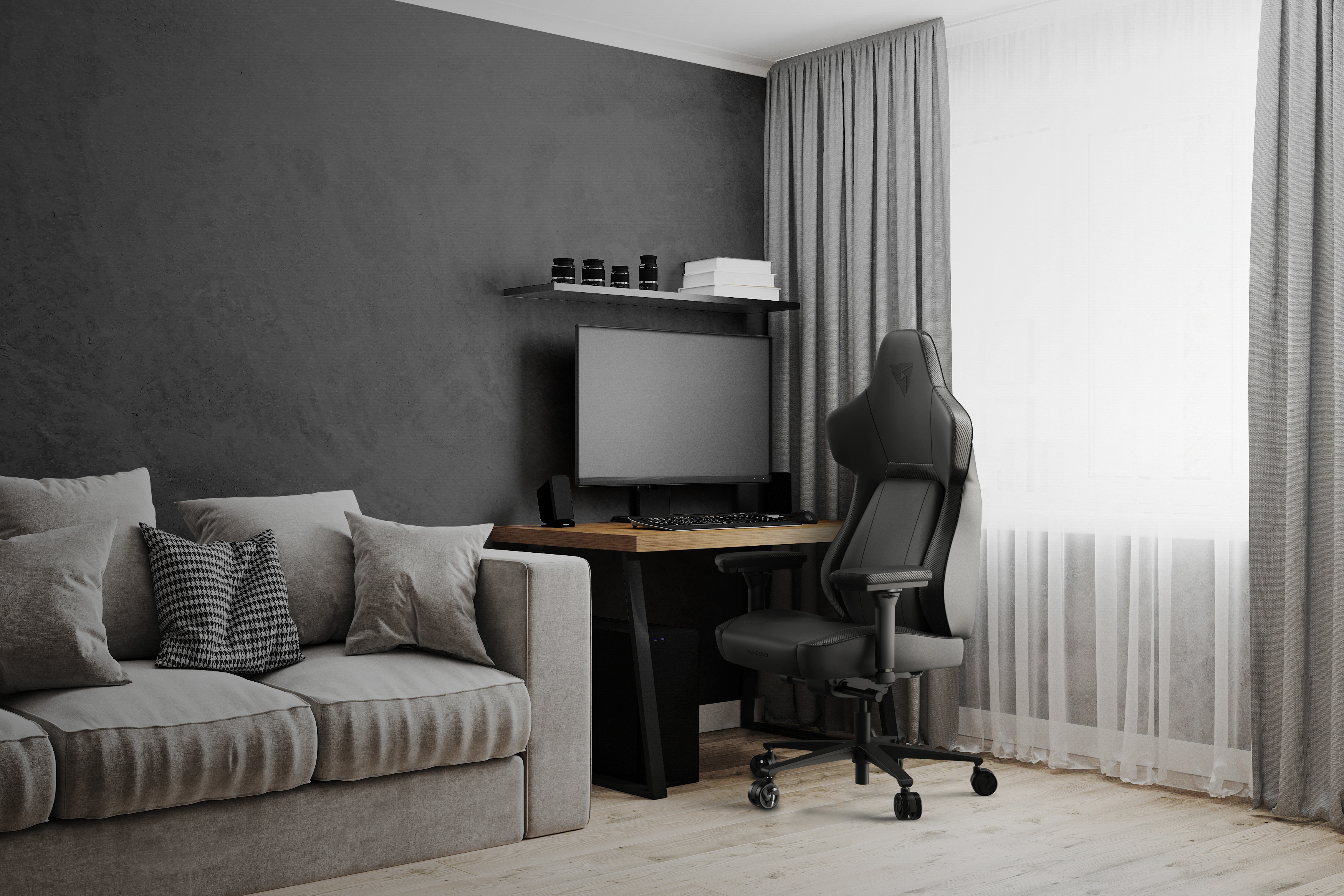 ThunderX3 Core Gaming Chair in front of a PC setup in a room with modern design
