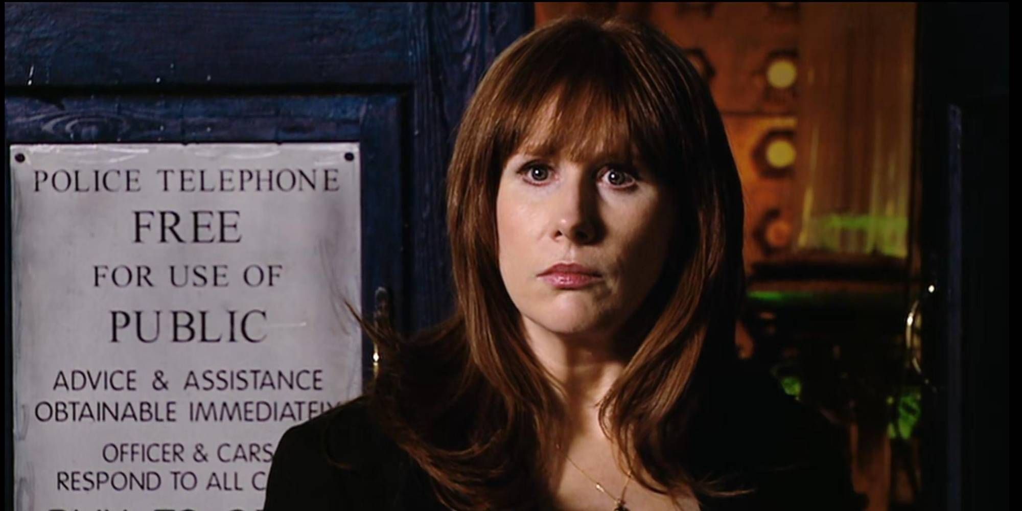 A ginger woman looking shocked and standing outside the TARDIS