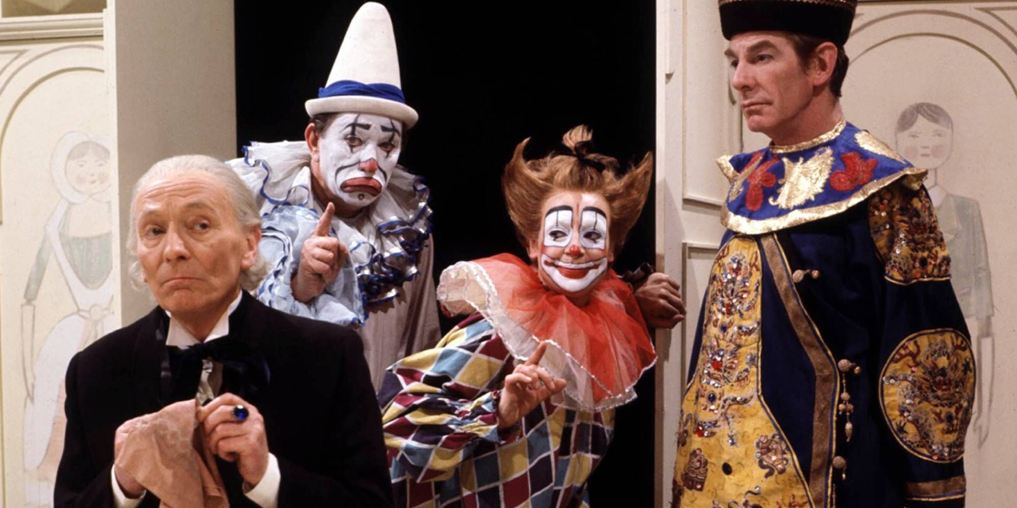 The First Doctor surrounded by a pair of clowns and the Celestial Toymaker