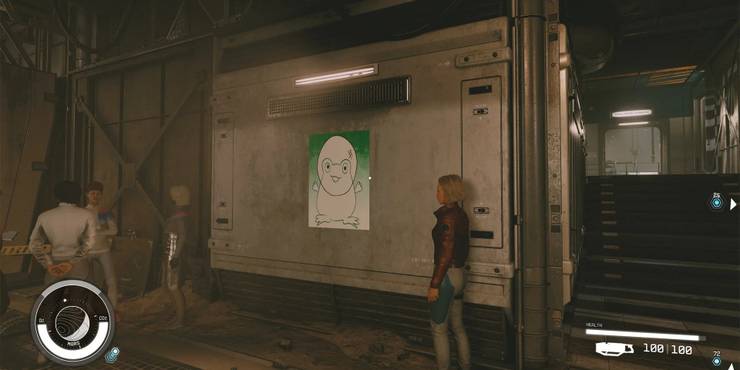 a space frog poster visible on the wall in the colony