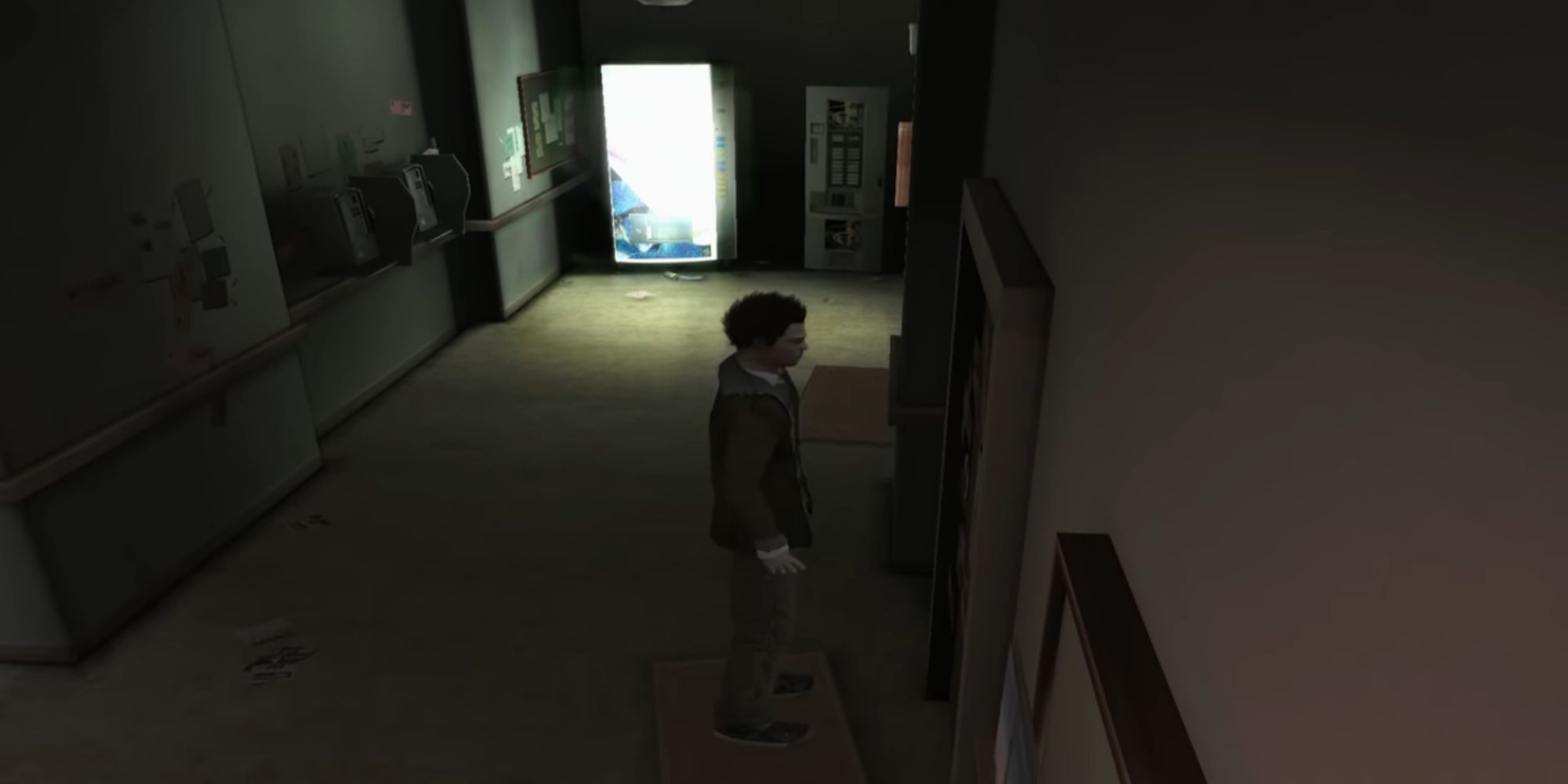 A man tries to use a vending machine in a dark hallway in obscure the aftermath