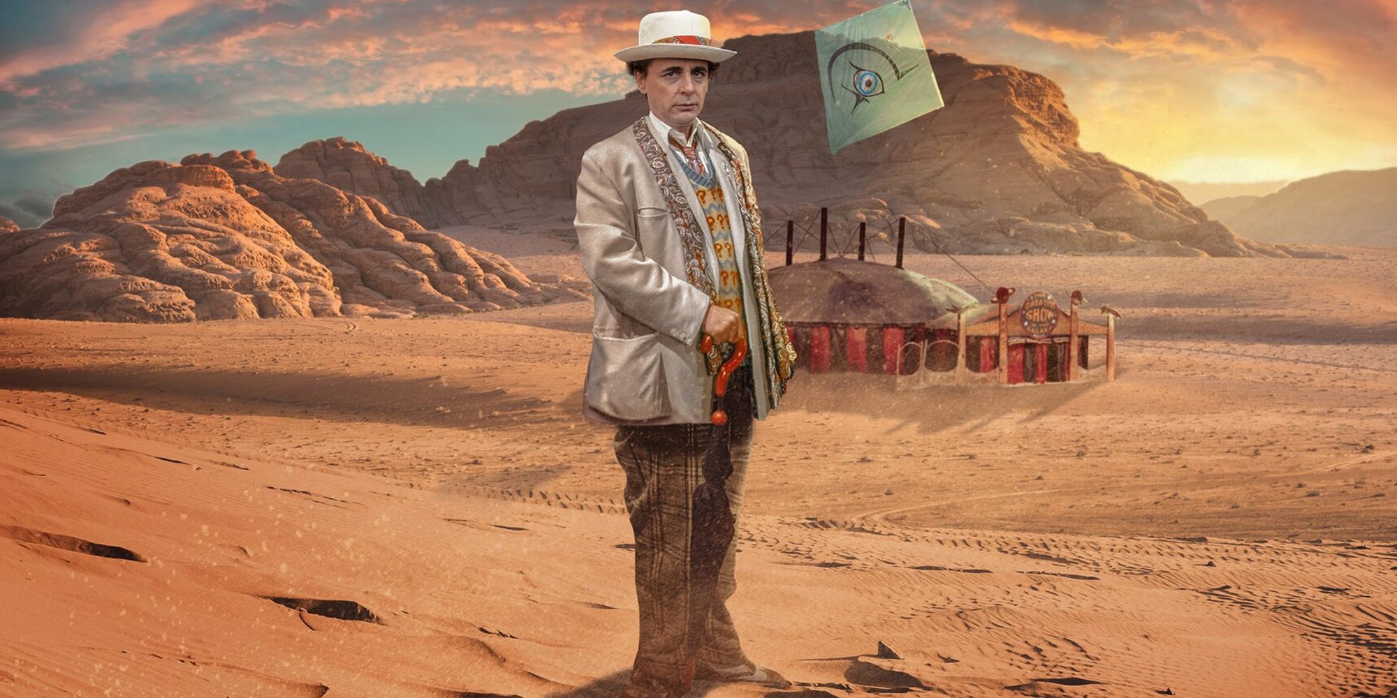 Seventh Doctor standing on a desert planet in front of a carnival