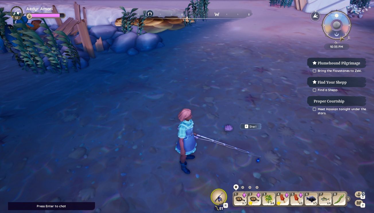 Player character standing on the coast of Bahari Bay next to a gatherable Shell in the shallow water in Palia.