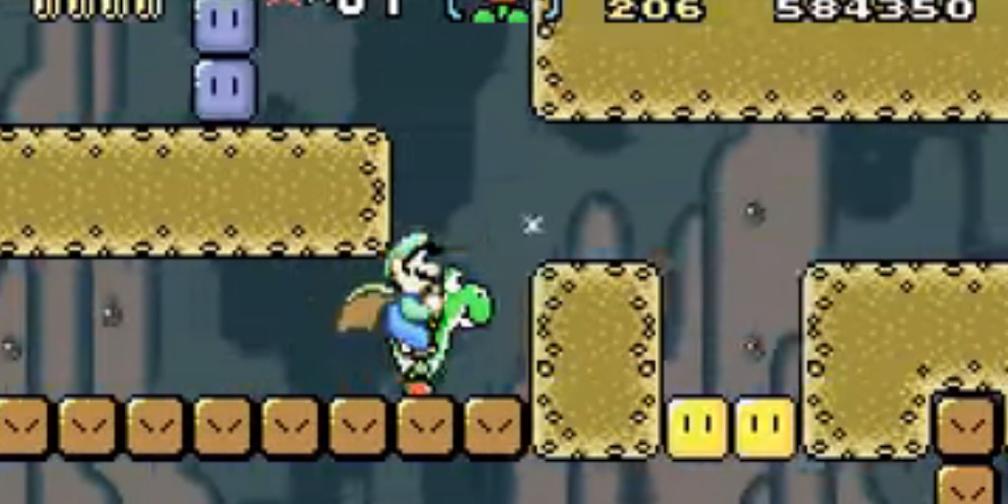 Luigi rides Yoshi through an underground tunnel