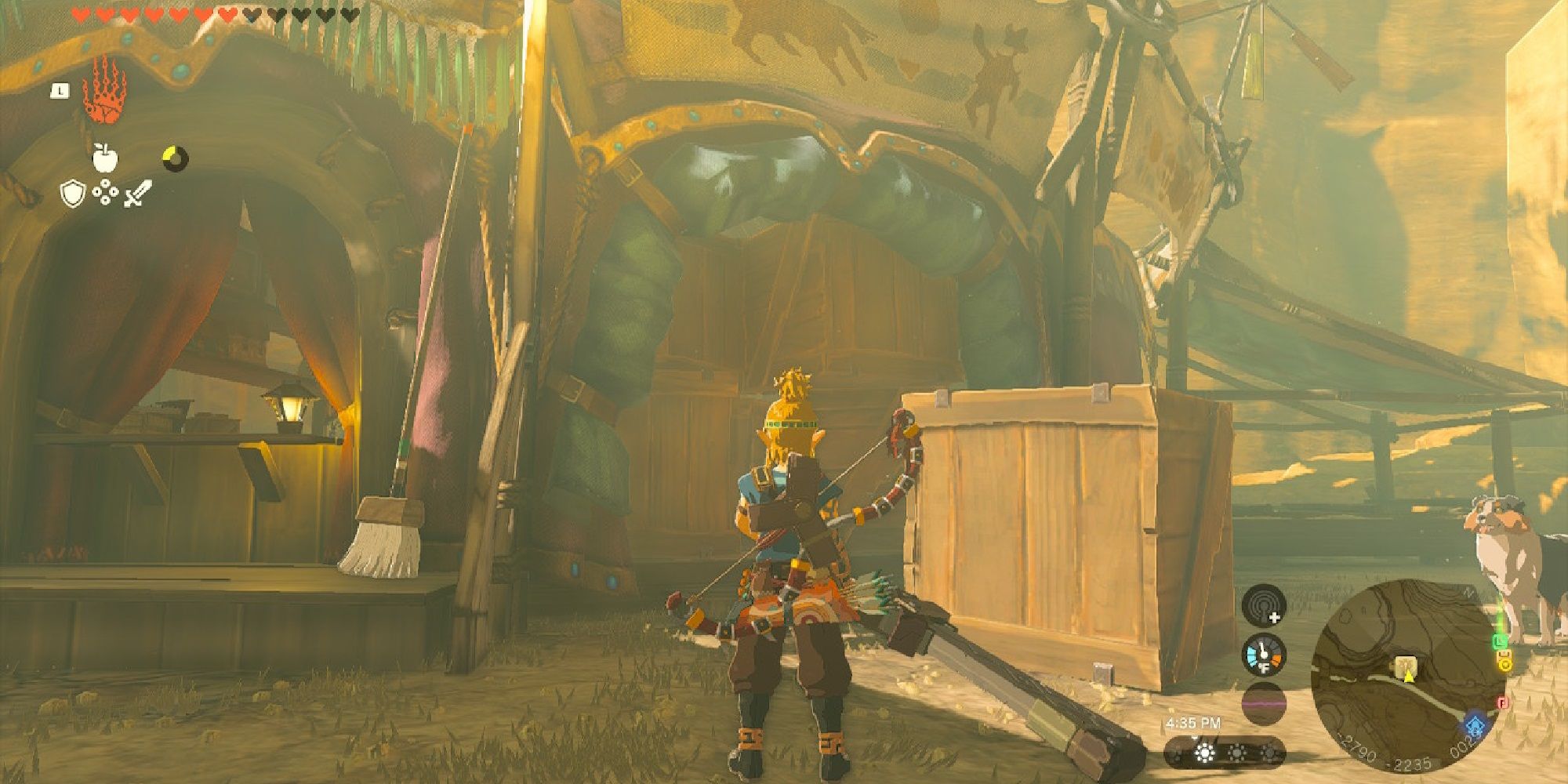 Link stands in front of a stable blocked by wooden boxes
