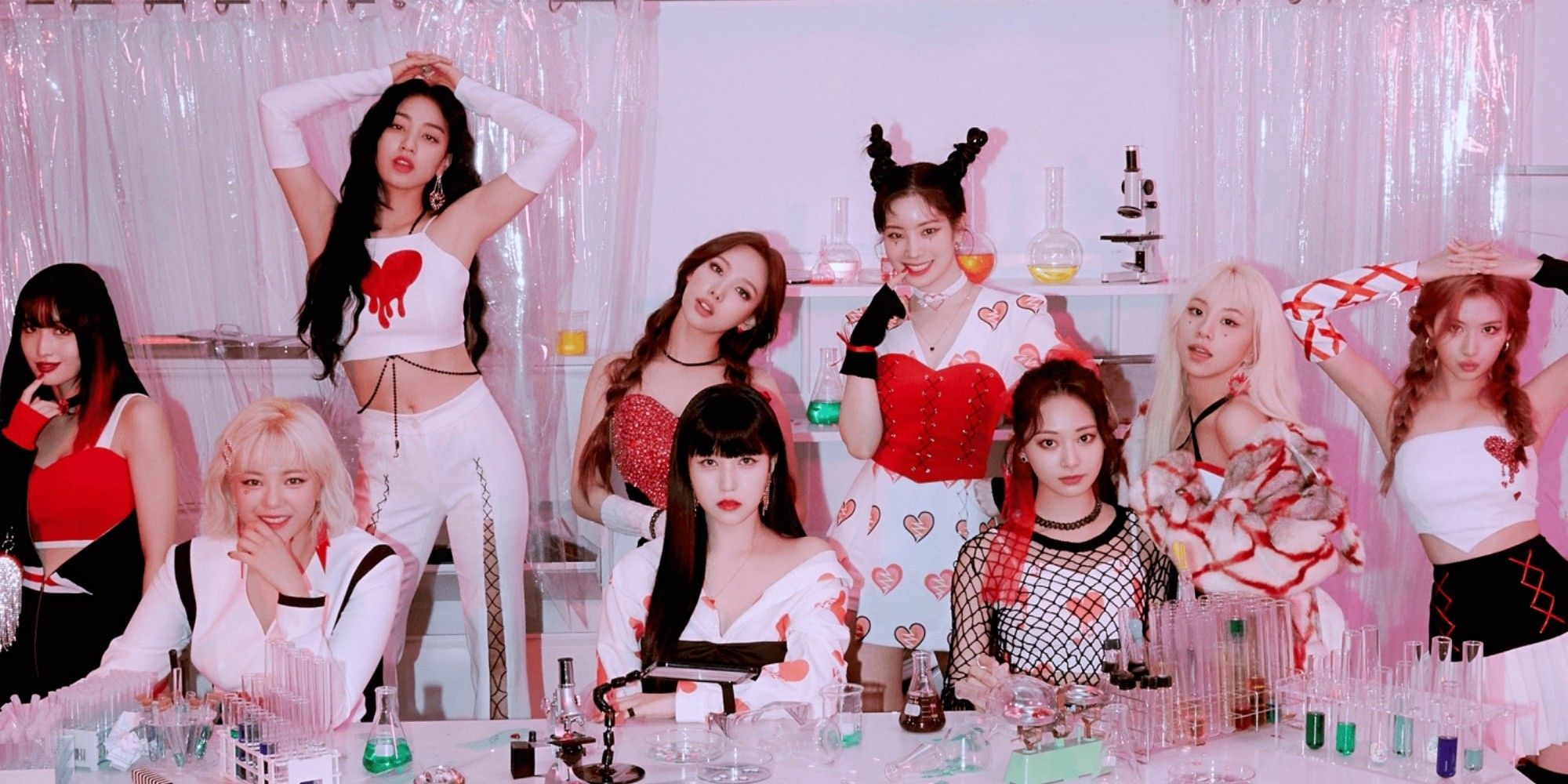 The nine members of k-pop group Twice posing together.