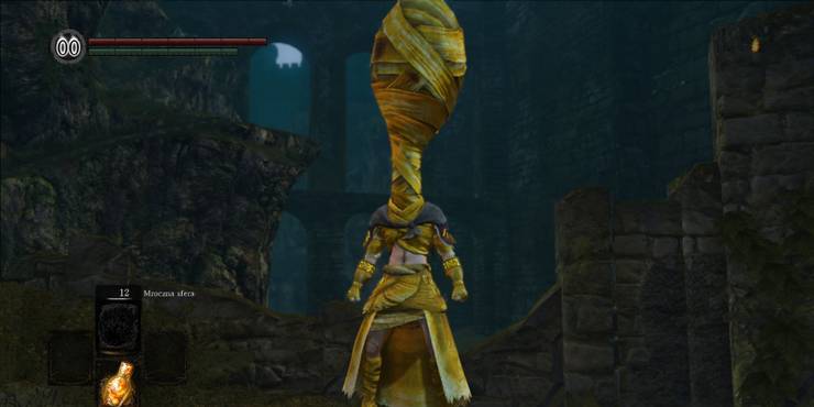 dark souls character wearing weird outfit made of bandages and robes
