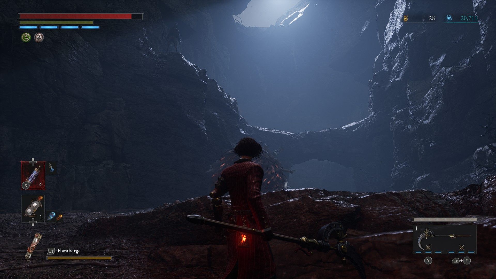 P faces rolling ball in ravine cave and spies carcass on the ledge above in Lies of P