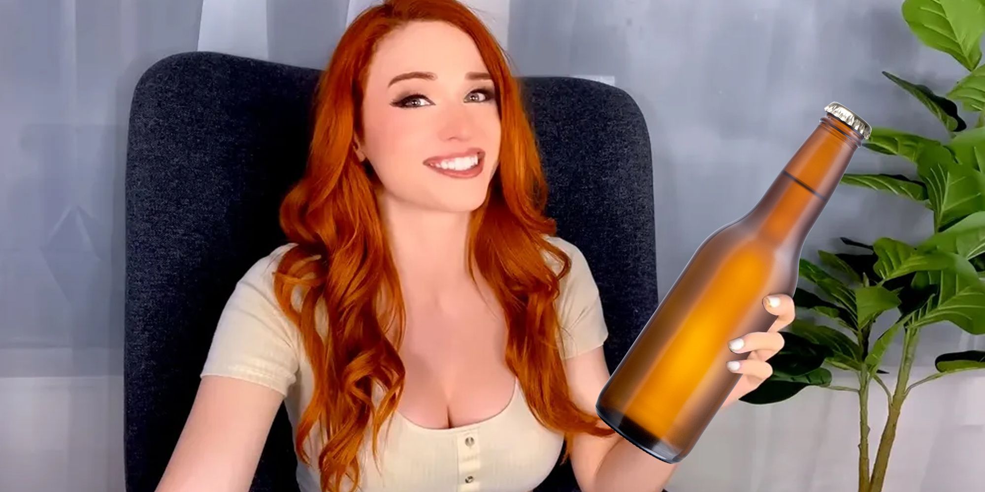 Amouranth holding a bottle of beer.